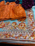 Beige Net  Saree with threadwork and orange Stitched Blouse