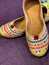 Gold Multicolor Embroidered Punjabi Jutti – Handcrafted Ethnic Footwear with Vibrant Threadwork & Pom-Pom Detailing