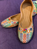 Multicolor Embroidered Punjabi Jutti – Handcrafted Ethnic Footwear with Mirror Work, Beads & Pom-Pom Detailing