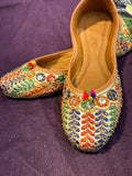 Multicolor Embroidered Punjabi Jutti – Handcrafted Ethnic Footwear with Mirror Work, Beads & Pom-Pom Detailing