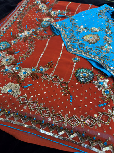 Orange Georgette Saree with heavy Embroidery and Stitched Blouse