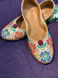Gold Multicolor Phulkari Embroidered Punjabi Jutti – Handcrafted Ethnic Footwear with Mirror Work & Pom-Pom Detailing