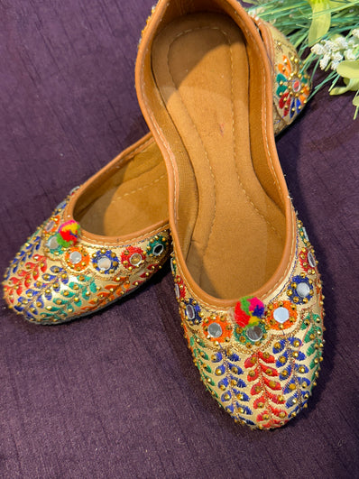 Multicolor Embroidered Punjabi Jutti – Handcrafted Ethnic Footwear with Mirror Work, Beads & Pom-Pom Detailing