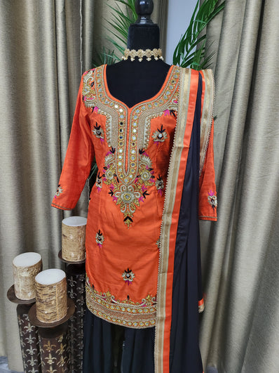 Partywear Suit in Orange color with Black Salwar